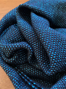 Close up picture of blue and black plain weave scarf
